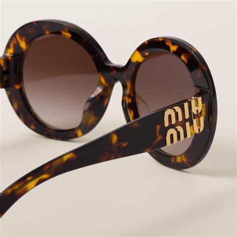 miu miu logo sonnenbrille|Blaue Gläser Miu Miu Logo Sonnenbrille .